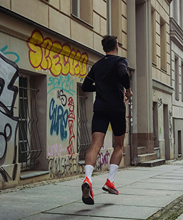 Runner in an urban setting for eco-conscious sports