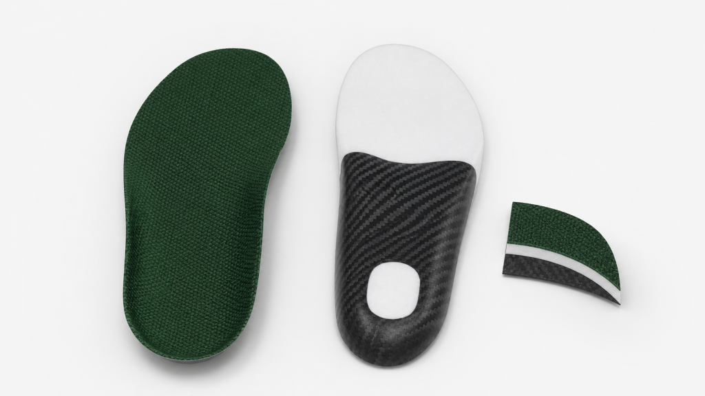 Custom carbon fiber foot insoles displayed in a clean, bright studio product rendering